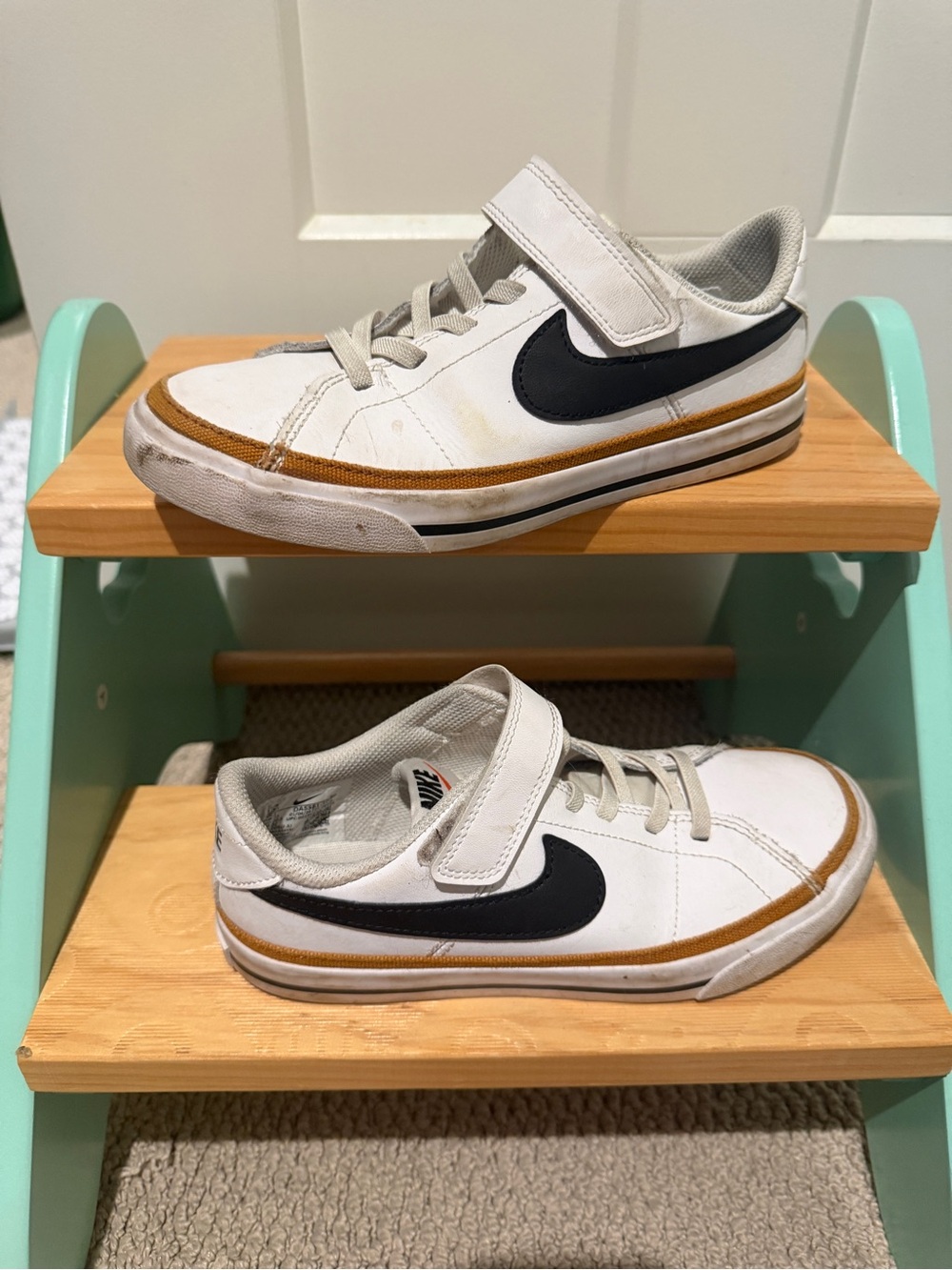 Nike Kids White Sneakers with Black Swoosh and Tan Stripe
